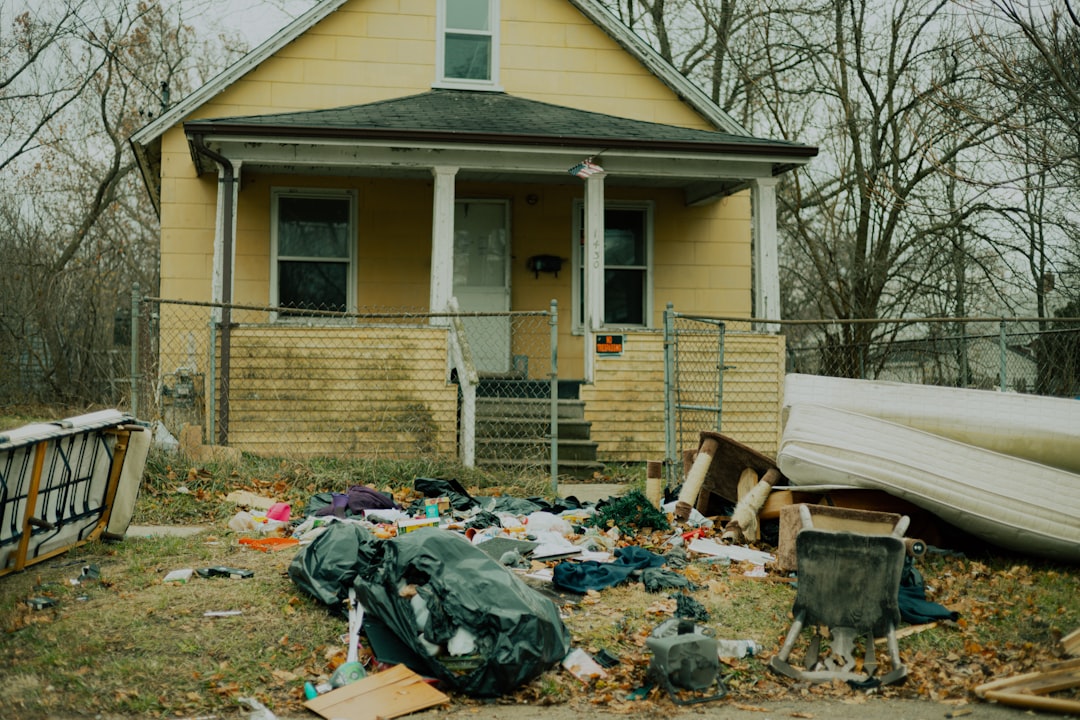 a-house-with-a-yard-and-garbage-d0by9qvdsr8